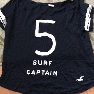 A surf captain crop top with a number five.